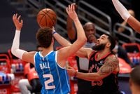 TAMPA, FLORIDA - JANUARY 16: Fred VanVleet #23 of the Toronto Raptors drives on LaMelo Ball #2 of the Charlotte Hornets during a game  at Amalie Arena on January 16, 2021 in Tampa, Florida. (Photo by Mike Ehrmann/Getty Images)