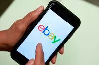 FILE - In this July 11, 2019, file photo, an Ebay app is shown on a mobile phone in Miami. The owner of the New York Stock Exchange has made an offer to buy online marketplace eBay Inc. That's according to a report by the Wall Street Journal on Tuesday, Feb. 4, 2020. (AP Photo/Wilfredo Lee, File)