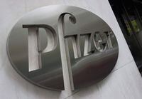 (FILES) In this file photo taken on April 26, 2016, the Pfizer company logo  at Pfizers headquarters in New York. - People who received Johnson & Johnson's Covid-19 vaccine may benefit from a booster dose of Pfizer or Moderna, preliminary results of a US study published October 13, 2021 showed. (Photo by Don EMMERT / AFP) (Photo by DON EMMERT/AFP via Getty Images)