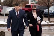 Cpl. Randy Stenger, left, and Const. Jessica Brown, return to court to resume their jury trial on charges of manslaughter and aggravated assault in Edmonton on Friday, Nov. 25, 2022. THE CANADIAN PRESS/Amber Bracken