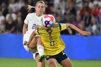 Sweden's Caroline Seger, right, and England's Alessia Russo challenge for the ball during the Women Euro 2022 semi final soccer match between England and Sweden at the Bramall Lane Stadium in Sheffield, England, Tuesday, July 26, 2022. (AP Photo/Rui Vieira)