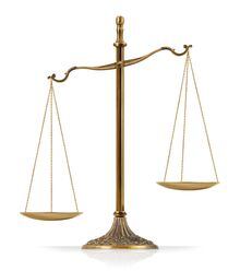 Unbalanced "Scales of Justice" isolated on white background.