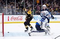 Dec 22, 2022; Boston, Massachusetts, USA; Boston Bruins center Trent Frederic (11) reacts after a goal by left wing Nick Foligno (17) (not pictured) past Winnipeg Jets goaltender Connor Hellebuyck (37) during the third period at TD Garden. Mandatory Credit: Bob DeChiara-USA TODAY Sports