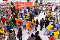 IMAGE DISTRIBUTED FOR WALMART - Customers check out at Walmart's Black Friday store event, on Thursday Nov. 28, in Bentonville, Ark. (Gunnar Rathbun/AP Images for Walmart)