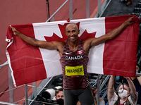 Canada's Damian Warner celebrates his gold medal win in men's decathlon during the Tokyo Olympics in Tokyo, Japan on Thursday, August 5, 2021. THE CANADIAN PRESS/Adrian Wyld