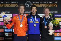 Davide Ghiotto of Italy, center and gold medal, Jorrit Bergsma of the Netherlands, left and silver medal, Ted-Jan Bloemen of Canada, right and bronze medal, celebrate on the podium of the 10,000m Men event of the Speedskating Single Distance World Championships at Thialf ice arena Heerenveen, Netherlands, Sunday, March 5, 2023. (AP Photo/Peter Dejong)