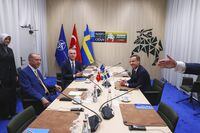 FILE - NATO Secretary General Jens Stoltenberg, center, Turkish President Recep Tayyip Erdogan, left, and Sweden's Prime Minister Ulf Kristersson, right, during a meeting ahead of a NATO summit in Vilnius, Lithuania, on July 10, 2023. The Turkish Parliament's foreign affairs committee was scheduled on Thursday to start debating Sweden's bid to join NATO, drawing the previously non-aligned country closer to membership in the Western military alliance. (Yves Herman, Pool Photo via AP, File)