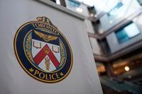 A Toronto Police Services logo is shown at headquarters, in Toronto, on Friday, August 9, 2019. Some of the six people injured in a brazen shooting outside a Toronto bakery were innocent bystanders seeking shelter from a heavy rainfall, city police said Wednesday as they appealed for witnesses to the crime.THE CANADIAN PRESS/Christopher Katsarov