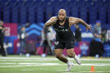 Eastern Michigan offensive lineman Sidy Sow runs a drill at the NFL football scouting combine in Indianapolis, Sunday, March 5, 2023. (AP Photo/Darron Cummings)