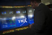 A man works in the broadcast centre at the TMX Group Ltd. in Toronto, on May 9, 2014. THE CANADIAN PRESS/Darren Calabrese