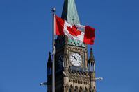A Canadian flag flies in front of the Peace Tower, on Parliament Hill, in Ottawa, on March 22, 2017.