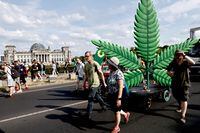 BERLIN, GERMANY - AUGUST 13: Activists demonstrating for the legalisation of marijuana march in the annual Hemp Parade (Hanfparade) on August 13, 2022 in Berlin, Germany. So far owning, cultivating and selling cannabis in Germany is still illegal, though the current coalition government campaigned on cannabis legalisation and is scheduled to begin debating corresponding legislation in coming months. (Photo by Carsten Koall/Getty Images)
