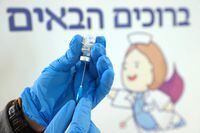 An Israeli health worker prepares to administer a dose of the Pfizer-BioNtech COVID-19 vaccine, in Tel Aviv, on Feb. 24, 2021.
