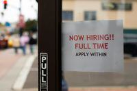 A retail store advertising a full time job on its open door in Oceanside, California, U.S., May 10, 2021. REUTERS/Mike Blake