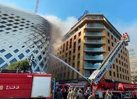 Crews extinguish a fire at a building under construction in Beirut, Lebanon, on Sept. 15, 2020.