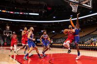Toronto Raptors' Fred VanVleet, second right, goes for a layup as New York Knicks' guard RJ Barrett, right, defends during first half NBA basketball action in Toronto on Sunday, January  2, 2022. THE CANADIAN PRESS/Chris Young