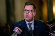 Saskatchewan Minister of Health Paul Merriman speaks to the media, on Wednesday, March 22, 2023. The Saskatchewan government is to spend up to $6 million to send patients to Calgary for hip and knee surgeries. THE CANADIAN PRESS/Heywood Yu