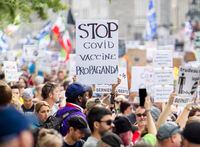 People attend a protest against the Quebec government’s measures to help curb the spread of COVID-19 in Montreal, Sunday, September 5, 2021, as the COVID-19 pandemic continues in Canada and around the world. THE CANADIAN PRESS/Graham Hughes