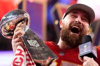 Kansas City Chiefs tight end Travis Kelce celebrates with the trophy after the win in overtime during the NFL Super Bowl 58 football game against the San Francisco 49ers on Sunday, Feb. 11, 2024, in Las Vegas. The Chiefs won 25-22. (AP Photo/Ashley Landis)