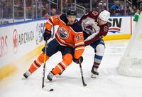 Colorado Avalanche defenceman Devon Toews (7) chases Edmonton Oilers' Connor McDavid (97) during second period NHL action in Edmonton on Saturday, April 9, 2022.THE CANADIAN PRESS/Jason Franson 