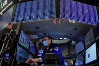 Traders work on the floor of the New York Stock Exchange (NYSE) in New York City on Jan. 25.