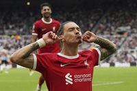 Liverpool's Darwin Nunez celebrates after scoring his sides first goal during the English Premier League soccer match between Newcastle United and Liverpool at St. James' Park, in Newcastle upon Tyne, England, Sunday Aug. 27, 2023. (Owen Humphreys/PA via AP)