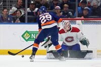 Feb 20, 2022; Elmont, New York, USA; Montreal Canadiens goaltender Andrew Hammond (37) makes a save against New York Islanders center Brock Nelson (29) during the shootout at UBS Arena. Mandatory Credit: Brad Penner-USA TODAY Sports
