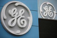 FILE PHOTO: The logo of U.S. conglomerate General Electric is seen on the company building in Belfort, France, October 19, 2019. REUTERS/Vincent Kessler/File Photo  GLOBAL BUSINESS WEEK AHEAD