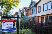 A sold sign is displayed in front of a house in the Riverdale area of Toronto on Wednesday, September 29, 2021. THE CANADIAN PRESS/Evan Buhler