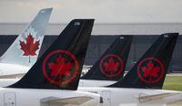 <div>Figures from aviation tracker FlightAware show that nearly 2,000 Air Canada flights were delayed or cancelled over the Canada Day long weekend. Air Canada logos are seen on the tails of planes at the airport in Montreal, Que., Monday, June 26, 2023. THE CANADIAN PRESS/Adrian Wyld</div>