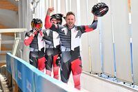 Canada's Justin Kripps, Ryan Sommer, Cam Stones and Benjamin Coakwell celebrate after the final run of the 4-man bobsleigh event at the Yanqing National Sliding Centre during the Beijing 2022 Winter Olympic Games in Yanqing on February 20, 2022. (Photo by Daniel MIHAILESCU / AFP) (Photo by DANIEL MIHAILESCU/AFP via Getty Images)