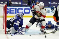 Tampa Bay Lightning goaltender Andrei Vasilevskiy (88) makes a save on a shot by Florida Panthers center Sam Bennett (9) during the third period in Game 6 of an NHL hockey Stanley Cup first-round playoff series Wednesday, May 26, 2021, in Tampa, Fla. (AP Photo/Chris O'Meara)