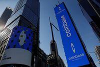 FILE PHOTO: The logo for Coinbase Global Inc, the biggest U.S. cryptocurrency exchange, is displayed on the Nasdaq MarketSite jumbotron and others at Times Square in New York, U.S., April 14, 2021. REUTERS/Shannon Stapleton