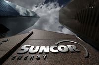 FILE PHOTO: The Suncor Energy logo is seen at their head office in Calgary, Alberta, Canada, April 17, 2019. REUTERS/Chris Wattie/File Photo