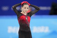 Kamila Valieva, 15, of the Russian Olympic Committee, reacts after the women's team free skate program during the figure skating competition at the 2022 Winter Olympics, Monday, Feb. 7, 2022, in Beijing. The 2022 Games' first major scandal has managed to involve the 15-year-old figure skater who has tested positive for using a banned heart medication that may cost her Russia-but-not-really-Russia team a gold medal in team competition. Kamila Valieva continues to train even as her final disposition is considered, and she may yet compete in the women's individual competition, in which she is favored. (AP Photo/Natacha Pisarenko)