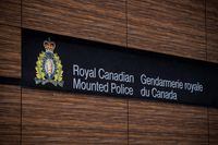 The RCMP logo is seen outside Royal Canadian Mounted Police "E" Division Headquarters, in Surrey, B.C., on Friday, April 13, 2018. THE CANADIAN PRESS/Darryl Dyck