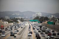 FILE -- Traffic on the I-405 Highway in Los Angeles on July, 25, 2019. At least 12 other states are already in line to adopt CaliforniaÕs zero-emissions vehicle mandate. (Jenna Schoenefeld/The New York Times)