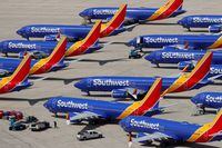 FILE PHOTO:  A number of grounded Southwest Airlines Boeing 737 MAX 8 aircraft are shown parked at Victorville Airport in Victorville, California, U.S., March 26, 2019.  REUTERS/Mike Blake/File Photo