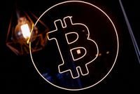 FILE PHOTO: A neon logo of cryptocurrency Bitcoin is seen at the Crypstation cafe, in downtown Buenos Aires, Argentina May 5, 2022. Picture taken May 5, 2022. REUTERS/Agustin Marcarian