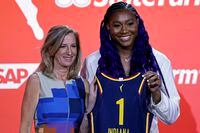 South Carolina's Aliyah Boston, right, poses for a photo with commissioner Cathy Engelbert after the Indiana Fever selected her first overall at the WNBA basketball draft Monday, April 10, 2023, in New York. (AP Photo/Adam Hunger)