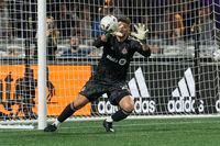Aug 27, 2022; Charlotte, North Carolina, USA; Toronto FC goalkeeper Alex Bono (25) reaches for the catch on a Charlotte FC shot on goal during the first half at Bank of America Stadium. Mandatory Credit: Jim Dedmon-USA TODAY Sports