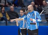 Quebec skip Mike Fournier, right, and third Felix Asselin discuss a shot as they play Manitoba at the Tim Hortons Brier curling championship at the Brandt Centre in Regina on Monday, March 5, 2018. THE CANADIAN PRESS/Andrew Vaughan