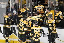 The Boston Bruins leave the ice after a 6-3 loss to the Florida Panthers in Game 2 of an NHL hockey first-round playoff series Wednesday, April 19, 2023, in Boston. (AP Photo/Charles Krupa)