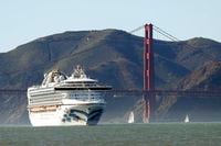 In this Feb. 11, 2020, photo, the Grand Princess cruise ship passes the Golden Gate Bridge as it arrives from Hawaii in San Francisco.