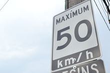 A speed limit sign in Canada, sign states the maximum speed is 50 km/hr is that area.