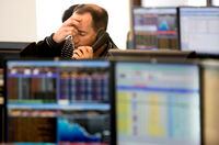 A TSX floor trader reacts to markets on Friday Oct. 3, 2008, in Toronto.