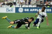 Sep 14, 2022; Vancouver, British Columbia, CAN;  Vancouver Whitecaps FC midfielder Pedro Vite (45) battles for the ball against LA Galaxy midfielder Riqui Puig Marti (6) during the second half at BC Place. Mandatory Credit: Anne-Marie Sorvin-USA TODAY Sports