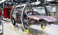 Porsche Taycan electric sports cars are pictured at the assembly line of the production site of German car producer Porsche AG in Stuttgart, southwestern Germany, on Sept, 26.