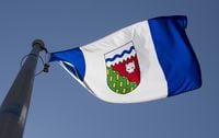 The Northwest Territories provincial flag flies on a flagpole in Ottawa on Monday July 6, 2020. Residents of the Northwest Territories are heading to the polls today, more than a month after the election was originally set to be held. THE CANADIAN PRESS/Adrian Wyld