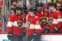 Florida Panthers center Aleksander Barkov (16) is congratulated by center Colin White (6) after scoring his third goal for a hat trick during the first period of an NHL hockey game against the Montreal Canadiens, Thursday, Dec. 29, 2022, in Sunrise, Fla. (AP Photo/Lynne Sladky)